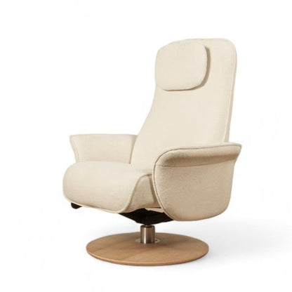 A beige upholstered nursing recliner chair with an ergonomic design, featuring an adjustable headrest and armrests, seated on a circular oak wood base.